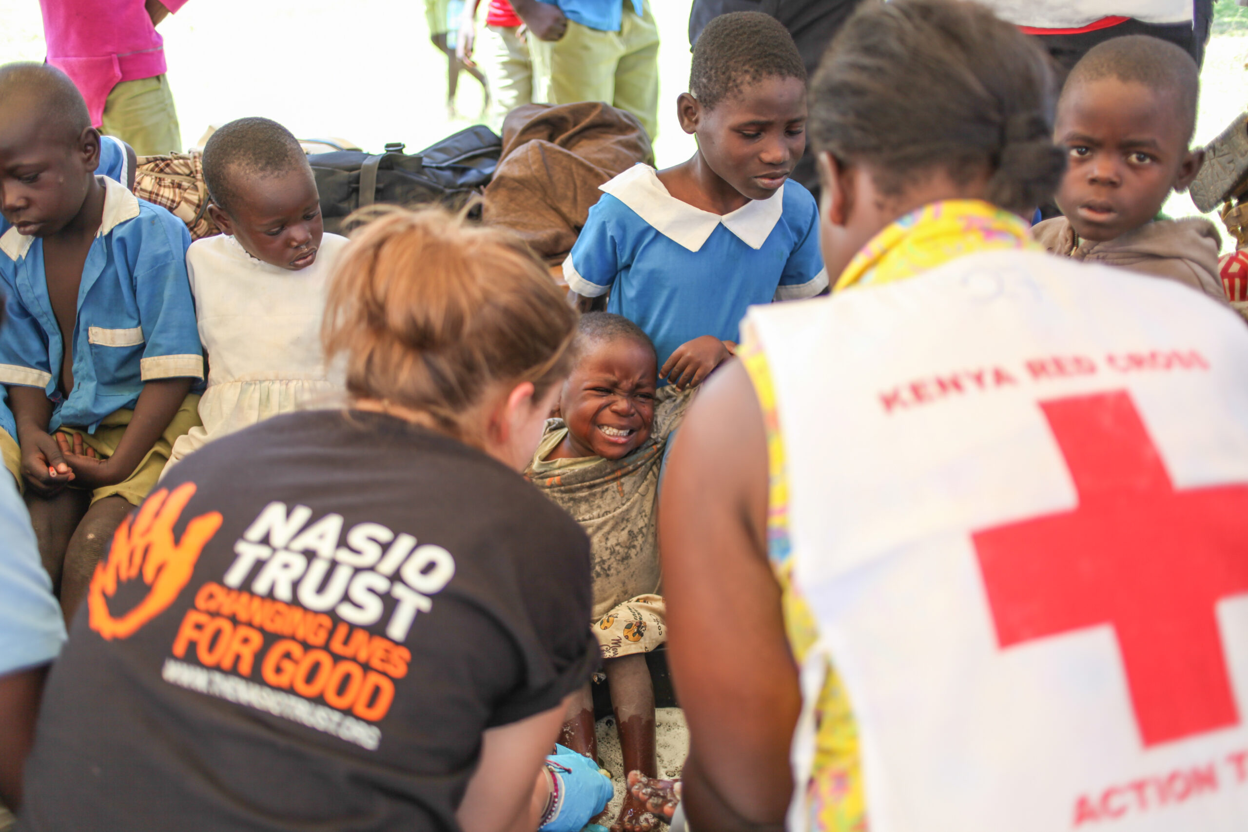 Nasio volunteer helping with first aid