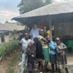 Luke with a group of the local kids