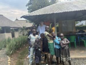 Luke with a group of the local kids